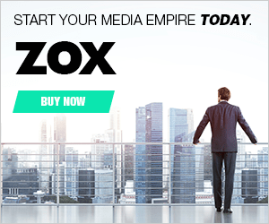 A man in a suit stands on a balcony overlooking a city skyline; text advertises "ZOX" with a "Buy Now" button and the phrase "Start your media empire today.